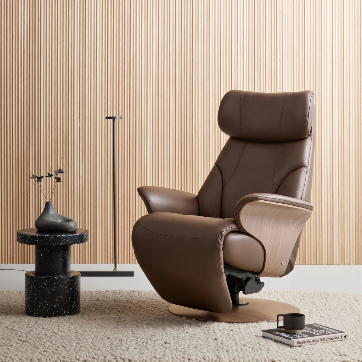 Stressless Adam Disc in Paloma Chestnut leather with wooden panels in a modern interior