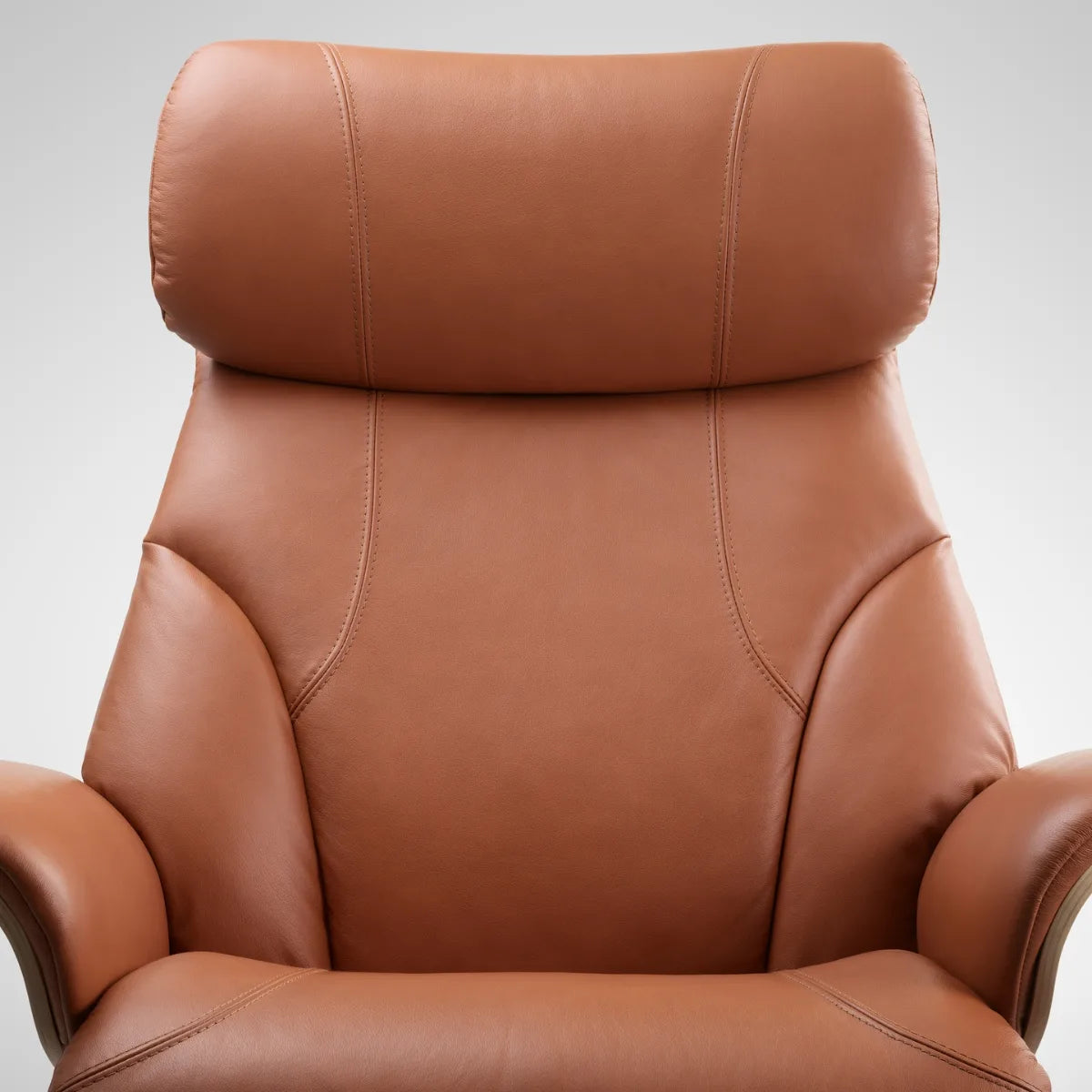 Front view of the headrest and backrest of a Stressless Adam in Paloma New Cognac leather with decorative stitching