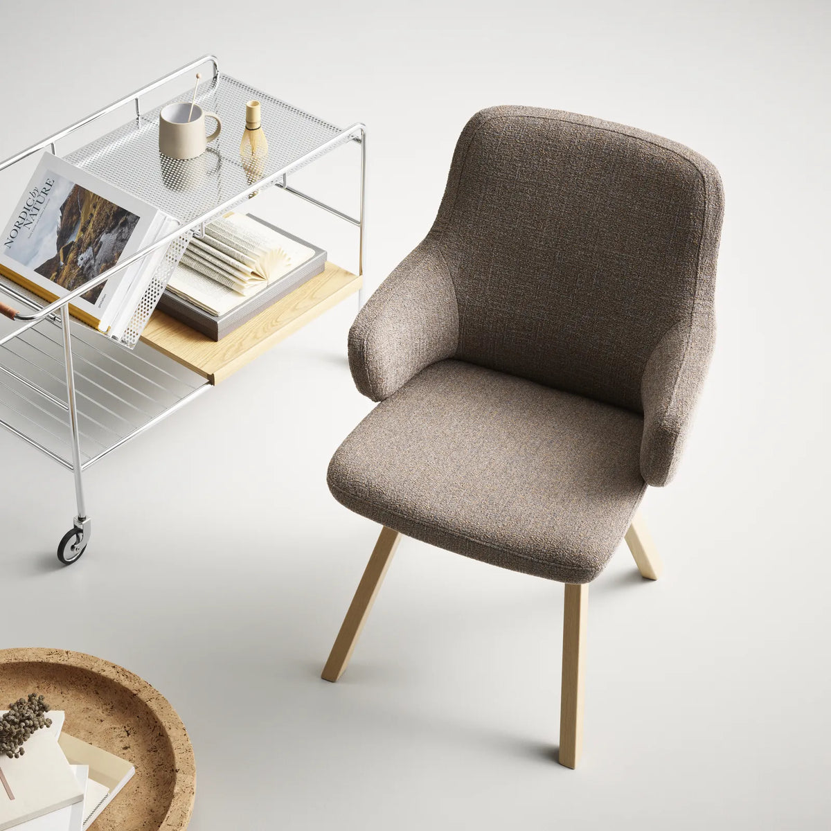 Stressless Vanilla dining chair with armrests in taupe Bloom fabric on a D200 oak base next to a serving cart